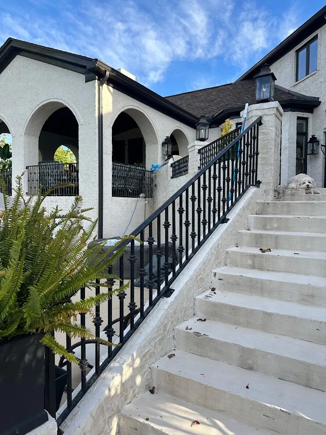 Black exterior railing on stairs